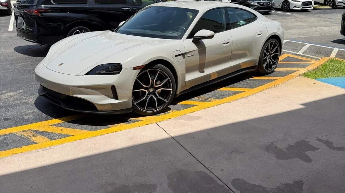A local businessman shot this photo of a Porsche Taycan parked in a fire lane in front of Roasters ‘N Toasters in Pinecrest.  State Attorney Katherine Fernandez Rundle arrived in the car, driven by her fiance.
